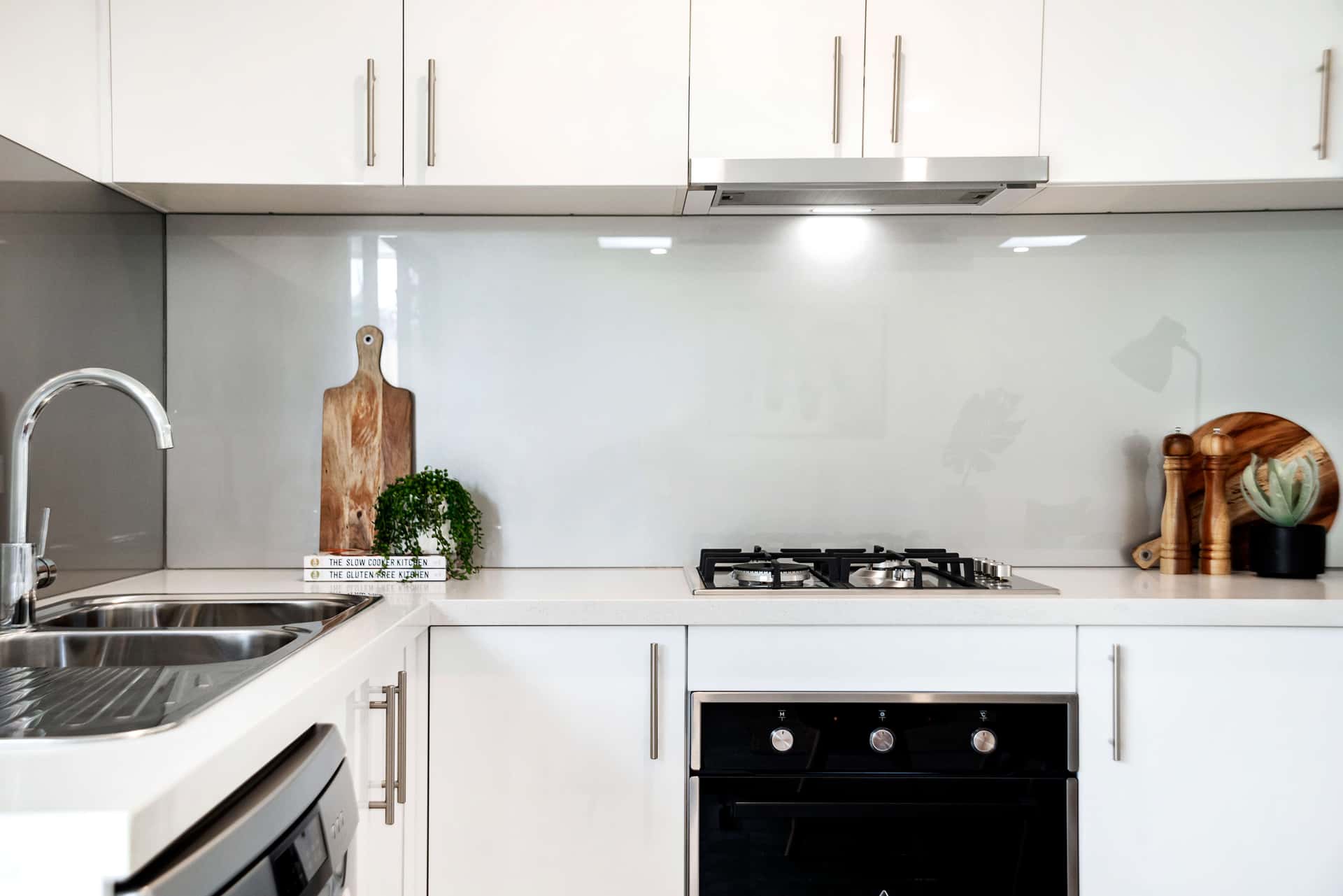 Clean White Kitchen with Quartz Countertops and Subway Tile